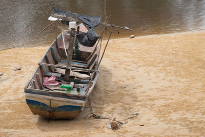 High angle view of abandoned boat moored on shore