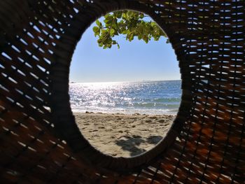 Scenic view of sea seen through window