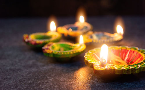 Close-up of lit candles on birthday cake