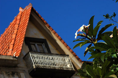 Low angle view of building against clear blue sky