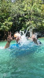 Group of people swimming in pool