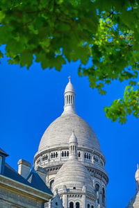 Low angle view of building against blue sky