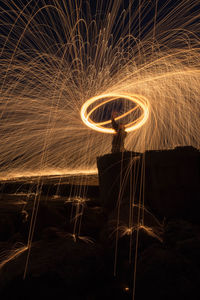 Close-up of illuminated lighting equipment at night