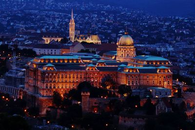 Illuminated buildings in city at night