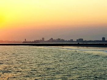 Scenic view of calm sea at sunset