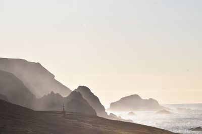 Scenic view of sea against clear sky during sunset