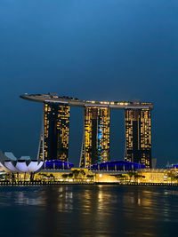 Illuminated modern buildings at waterfront