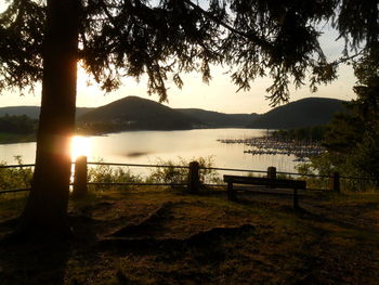 Scenic view of lake against sky during sunset