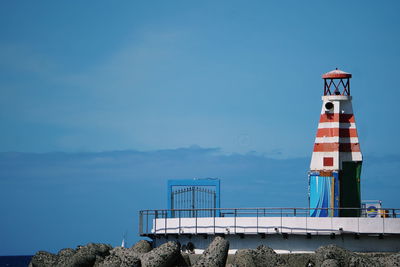 Lighthouse against clear blue sky