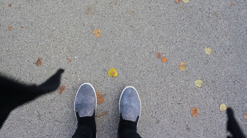 Low section of person standing on street