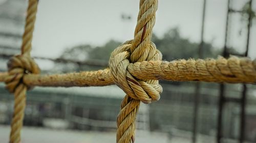 Close-up of rope tied on metal