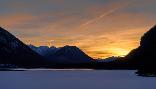 Scenic view of mountains against sky during sunset