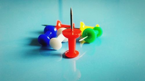 Close-up of multi colored toy on blue table