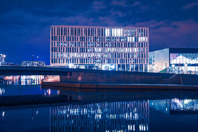 Reflection of illuminated buildings in water