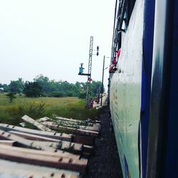 Train on railroad track against sky