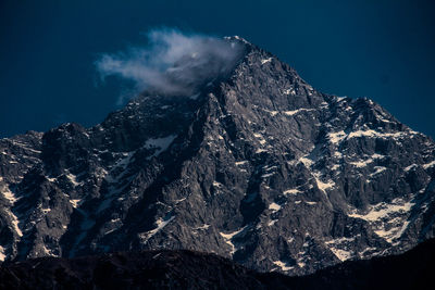 Panoramic view of snowcapped mountains against clear sky