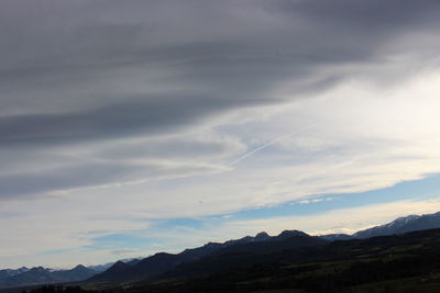 Scenic view of silhouette mountains against sky during sunset