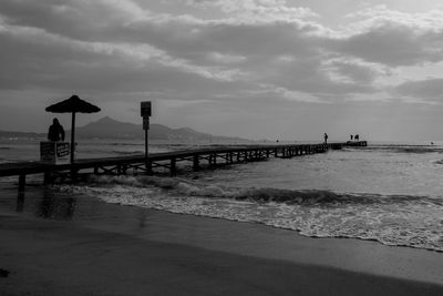 Pier over sea against sky