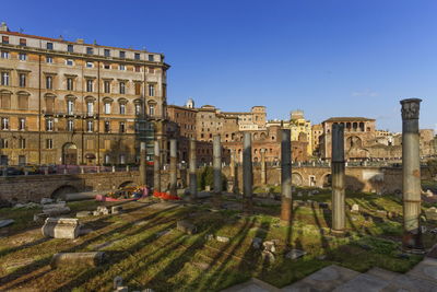 Roman forum with columns by day in roma, italy