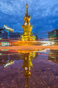 Reflection of illuminated building in water