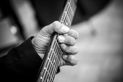 Close-up of man playing musical equipment