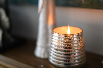 Close-up of tea light candles on table