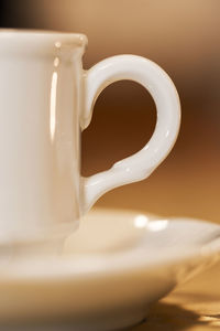 Close-up of coffee cup on table