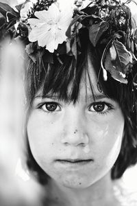 Close-up portrait of girl with flowers