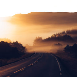 Road against sky during sunset