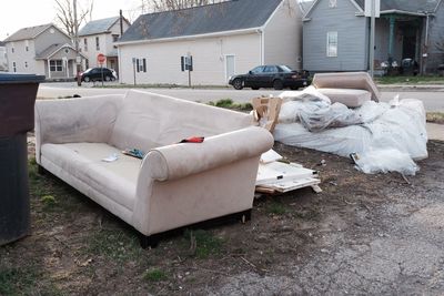 Garbage bin in yard of building