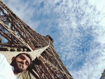 Low angle portrait of man against sky