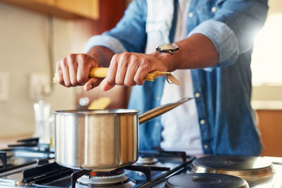 Midsection of man preparing food