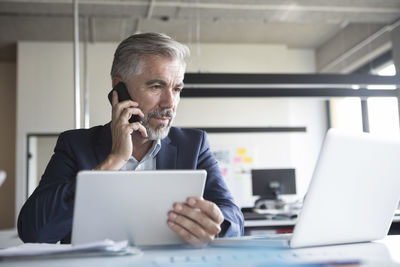 Businessman working at office desk