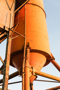 Low angle view of factory against sky