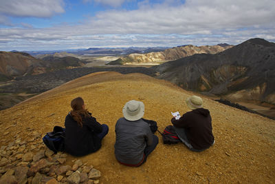 Three friends admiring the view in landmannalaugar