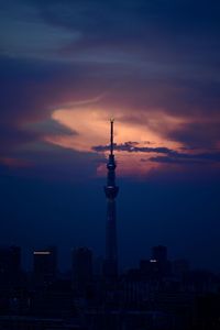 A tower of a city during sunset hour color of pink and blue. tokyo sky tree