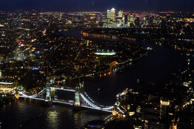 Aerial view of illuminated city at night