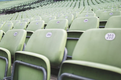 Close-up of empty seats in stadium