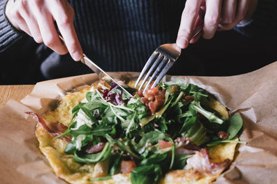 Midsection of man preparing food on table