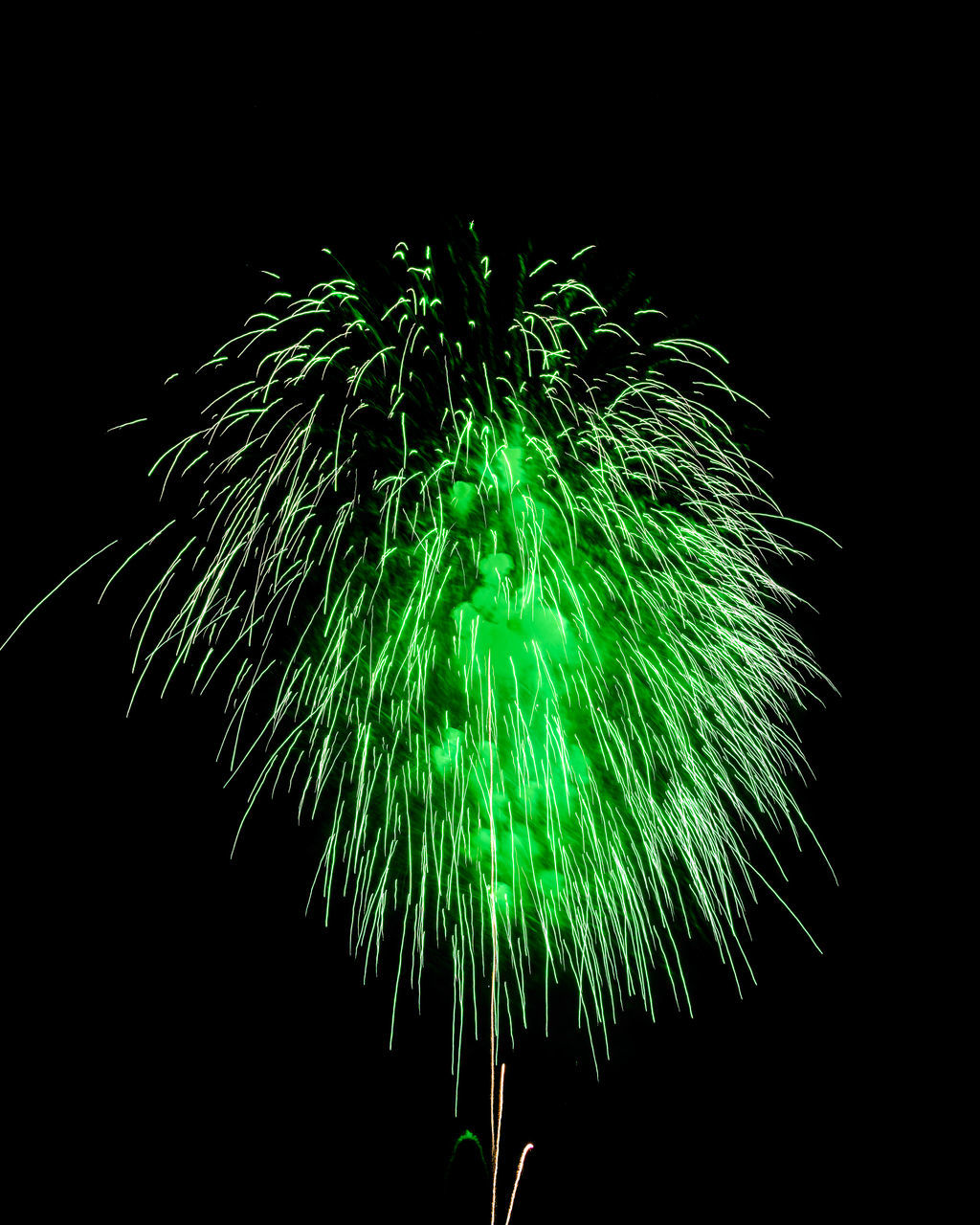 fireworks, motion, night, black background, illuminated, green, celebration, exploding, firework display, recreation, no people, glowing, event, nature, arts culture and entertainment, multi colored, blurred motion, studio shot, sky, long exposure, light - natural phenomenon, outdoors, copy space