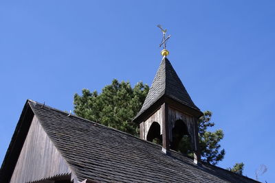 Low angle view of old building against blue sky