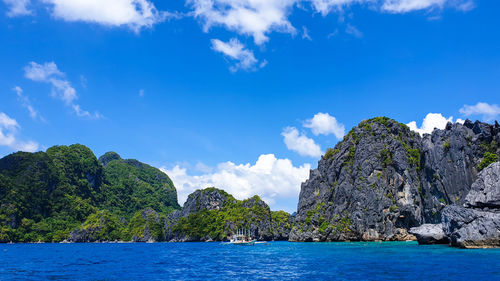 Scenic view of sea against blue sky