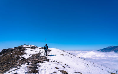 Low angle view of mountain against clear blue sky