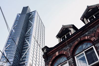 Low angle view of skyscrapers against sky