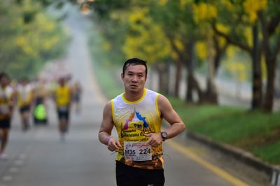 Young man standing against blurred background