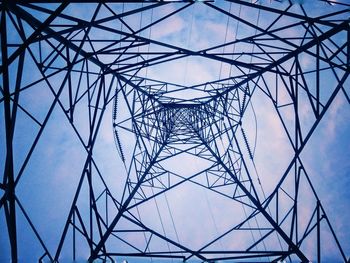 Low angle view of electricity pylon against sky