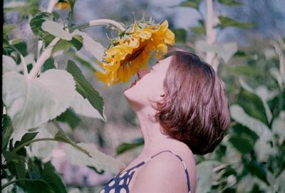 Close-up of woman with flowers