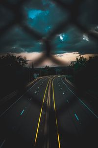 Aerial view of highway against sky at dusk