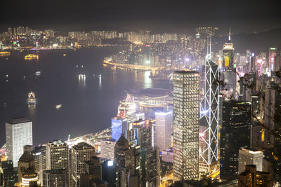 High angle view of city lit up at night