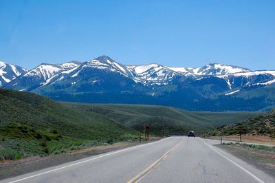 Road passing through snowcapped mountain